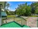 Inviting front porch with green painted wood and view of quiet residential street at 3839 Woodridge Circle, Little River, SC 29566