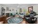 Comfortable living room featuring a fireplace, ceiling fan, hardwood floors, and cozy furniture at 3839 Woodridge Circle, Little River, SC 29566