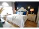 Stylish bedroom featuring a tufted headboard, designer mirrors, and large windows for natural light at 390 Lands End Blvd. # 4-201, Myrtle Beach, SC 29572