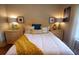 Relaxing bedroom with a wicker headboard, soft pillows, and ample lighting for a peaceful retreat at 390 Lands End Blvd. # 4-201, Myrtle Beach, SC 29572