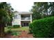 Two-story condo with a private balcony overlooking manicured landscaping at 390 Lands End Blvd. # 4-201, Myrtle Beach, SC 29572