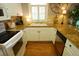 Well-maintained kitchen with granite countertops, white cabinets, and stainless-steel appliances at 390 Lands End Blvd. # 4-201, Myrtle Beach, SC 29572