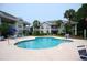 Inviting community pool with plenty of lounge seating for relaxation by the water at 390 Lands End Blvd. # 4-201, Myrtle Beach, SC 29572