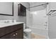 Bathroom showcasing a single vanity sink and bathtub shower combo with added storage cabinet at 4115 Alvina Way, Myrtle Beach, SC 29579