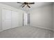 Bright bedroom with plush carpeting, large closet, and a ceiling fan for added comfort at 4115 Alvina Way, Myrtle Beach, SC 29579
