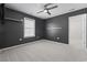 Sleek bedroom with plush carpet, modern ceiling fan, and a bright window for ample natural light at 4115 Alvina Way, Myrtle Beach, SC 29579