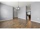 Open-concept dining area with hardwood floors, stylish chandelier, and easy access to the kitchen at 4115 Alvina Way, Myrtle Beach, SC 29579