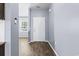 Hallway featuring wood flooring and a white front door at 4115 Alvina Way, Myrtle Beach, SC 29579