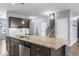 Bright kitchen features an island with granite countertop and stainless steel appliances at 4115 Alvina Way, Myrtle Beach, SC 29579