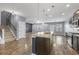 Open-concept kitchen with granite countertops, pendant lighting, and stainless steel appliances at 4115 Alvina Way, Myrtle Beach, SC 29579