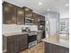 Modern kitchen with stainless steel appliances, granite countertops, and ample cabinet space at 4115 Alvina Way, Myrtle Beach, SC 29579