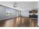 Spacious living room with hardwood floors and large windows providing natural light at 4115 Alvina Way, Myrtle Beach, SC 29579