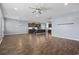 Open-concept living room featuring hardwood floors, recessed lighting, and kitchen view at 4115 Alvina Way, Myrtle Beach, SC 29579