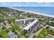 An aerial shot showcasing this beach condo with pool, beach access and surrounding neighborhood at 423 Parker Dr. # 334, Pawleys Island, SC 29585