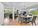 Bright living area with a tile floor, recessed lights and a dining space next to a sunroom at 423 Parker Dr. # 334, Pawleys Island, SC 29585