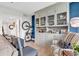 Comfortable seating area with custom-built ins provides ample storage and display space at 423 Parker Dr. # 334, Pawleys Island, SC 29585