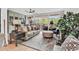 Unwind in this cozy living room with a comfortable sofa, patterned rug, and sliding door to the balcony at 423 Parker Dr. # 334, Pawleys Island, SC 29585