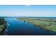 Scenic aerial view of a river with lush greenery and a boat on the water at 423 Parker Dr. # 334, Pawleys Island, SC 29585