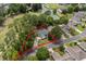 Aerial view of the property outlining the backyard, mature trees, with the community golf course and pond in the background at 4314 Turtle Ln., Little River, SC 29566