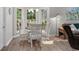 Cozy dining area with natural light, perfect for enjoying meals with Gathering and friends at 4314 Turtle Ln., Little River, SC 29566