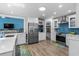 Well-equipped kitchen features stainless steel appliances, white cabinetry, and a functional design, perfect for cooking at 4314 Turtle Ln., Little River, SC 29566