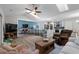 Open-concept living space with vaulted ceilings, a kitchen island with seating, and a cozy seating area at 4314 Turtle Ln., Little River, SC 29566