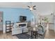 Bright living room features a fireplace, comfortable seating, high ceilings, and views into the dining and kitchen areas at 4314 Turtle Ln., Little River, SC 29566
