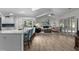 Inviting living room featuring an open floor plan, hardwood floors, and sliding glass doors to the patio at 4314 Turtle Ln., Little River, SC 29566