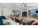 Spacious living area featuring a ceiling fan, hardwood floors, and a sliding glass door to the patio at 4314 Turtle Ln., Little River, SC 29566