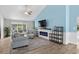 Inviting living room with a modern fireplace, plush seating, open floor plan, and lots of natural light at 4314 Turtle Ln., Little River, SC 29566