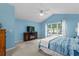 Bright main bedroom with vaulted ceiling and carpet flooring; includes modern furnishings and window views at 4314 Turtle Ln., Little River, SC 29566