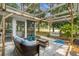 Charming patio with swing, outdoor seating, and serene views of the surrounding green landscape at 4314 Turtle Ln., Little River, SC 29566