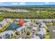 Beautiful aerial view of condo community featuring a pond, fountain, and lush landscaping at 4820 Magnolia Lake Dr. # 305, Myrtle Beach, SC 29577