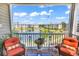 Relaxing balcony with seating overlooking a tranquil pond and lush landscaping at 4820 Magnolia Lake Dr. # 305, Myrtle Beach, SC 29577