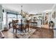Open-concept dining and kitchen featuring hardwood flooring and modern finishes at 4820 Magnolia Lake Dr. # 305, Myrtle Beach, SC 29577