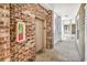 A well-maintained elevator inside a condo building with brickwork and an open hallway at 4820 Magnolia Lake Dr. # 305, Myrtle Beach, SC 29577
