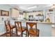 Inviting kitchen with bar seating, stainless appliances, and light-colored cabinetry at 4820 Magnolia Lake Dr. # 305, Myrtle Beach, SC 29577
