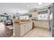 Eat-in kitchen featuring white cabinetry, tile backsplash, and neutral countertops at 4820 Magnolia Lake Dr. # 305, Myrtle Beach, SC 29577