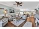Spacious living room with hardwood floors, comfortable sofas, and a seamless flow to the kitchen at 4820 Magnolia Lake Dr. # 305, Myrtle Beach, SC 29577