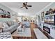 Cozy coastal-themed living room with hardwood floors, comfortable seating, and an electric fireplace at 4820 Magnolia Lake Dr. # 305, Myrtle Beach, SC 29577