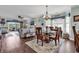Open-concept living room and dining area with hardwood flooring and natural light at 4820 Magnolia Lake Dr. # 305, Myrtle Beach, SC 29577