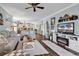 Inviting living room with hardwood floors, coastal decor, and a fireplace for a relaxed atmosphere at 4820 Magnolia Lake Dr. # 305, Myrtle Beach, SC 29577