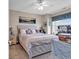 Comfortable main bedroom with a light-toned wooden bed frame, carpeting, and serene artwork at 4820 Magnolia Lake Dr. # 305, Myrtle Beach, SC 29577