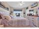 Airy main bedroom features a dresser, a bed with soft, neutral tones, and a window at 4820 Magnolia Lake Dr. # 305, Myrtle Beach, SC 29577