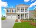 Charming two-story home with a welcoming porch, well-manicured lawn, and three-car garage at 5034 Selene Ct., Myrtle Beach, SC 29588