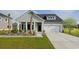 Charming one-story home with a well-manicured lawn, beautiful landscaping, and an attached two-car garage at 5051 Selene Ct., Myrtle Beach, SC 29588