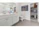 Bright bathroom with double vanity, artwork, and walk in closet at 519 Royal Jay Ln., Longs, SC 29568