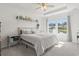 Bright bedroom features tray ceiling, lots of plants and a view of the lake and fountain at 519 Royal Jay Ln., Longs, SC 29568