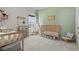 Playful Bedroom room with teepee, crib, and bright green walls at 519 Royal Jay Ln., Longs, SC 29568