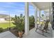 Comfortable front porch with chairs and views of the landscaped yard at 519 Royal Jay Ln., Longs, SC 29568